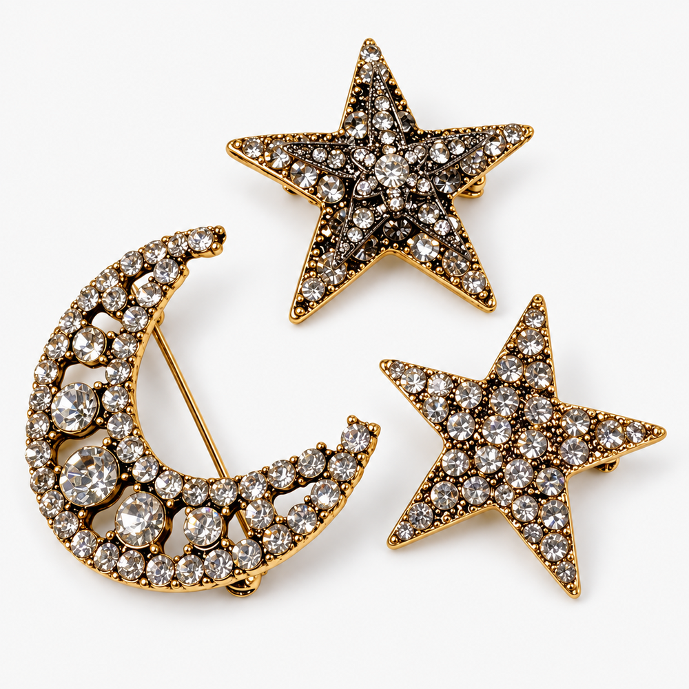 Broche lua e estrelas dourado